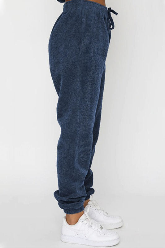 Corduroy pants from two-piece Western set with elasticized waist in navy blue.