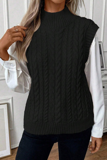 Cable-knit mock neck sweater vest in black, made of 100% acrylic, highly stretchy.