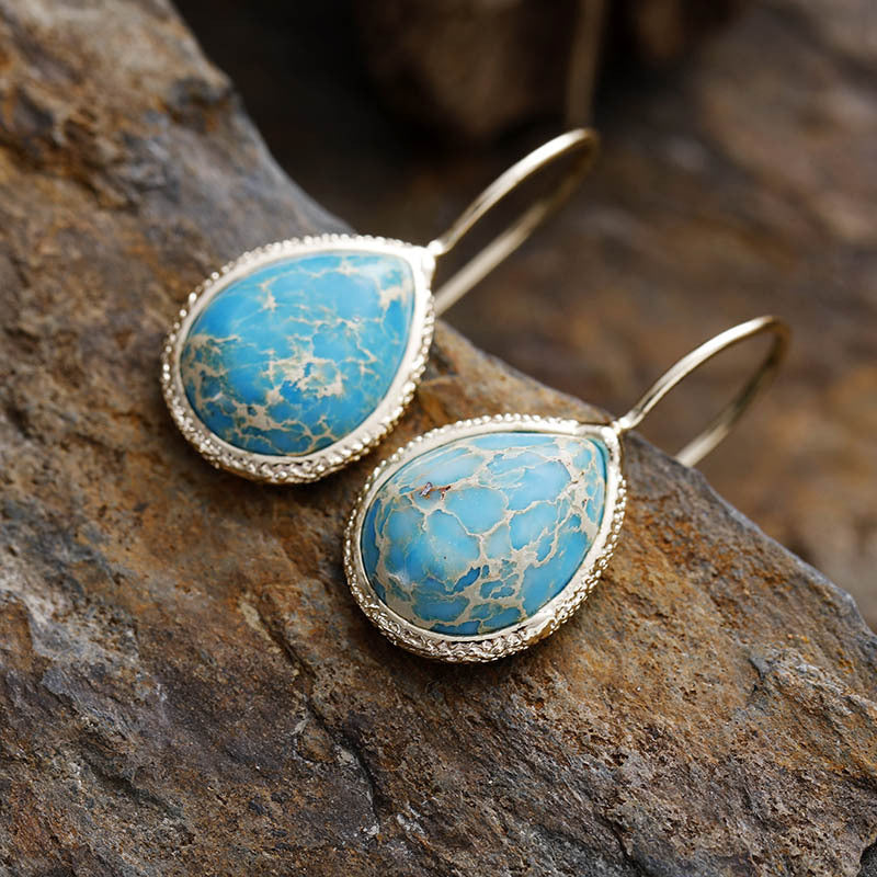 18K gold-plated copper teardrop earrings with natural blue stone.