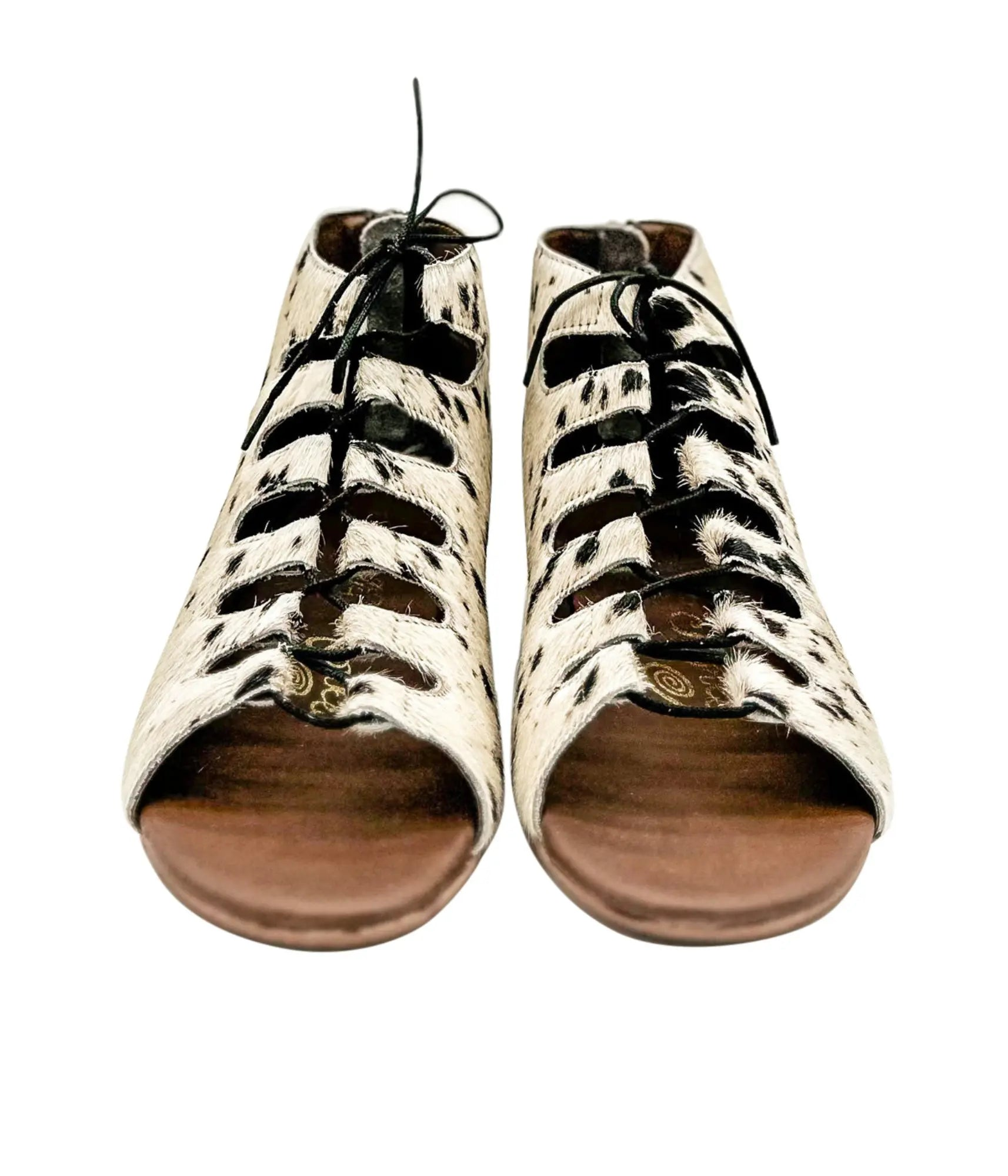 Nola Sandals in black and white with genuine hide upper and lace-up design.