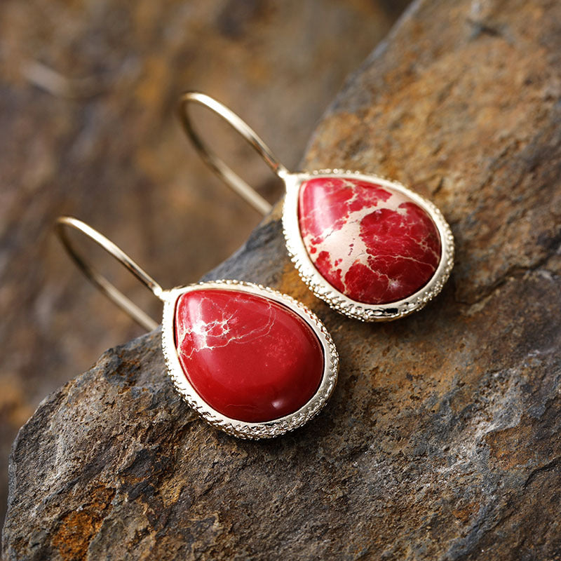 Teardrop earrings with natural red stone and 18K gold-plated copper setting.