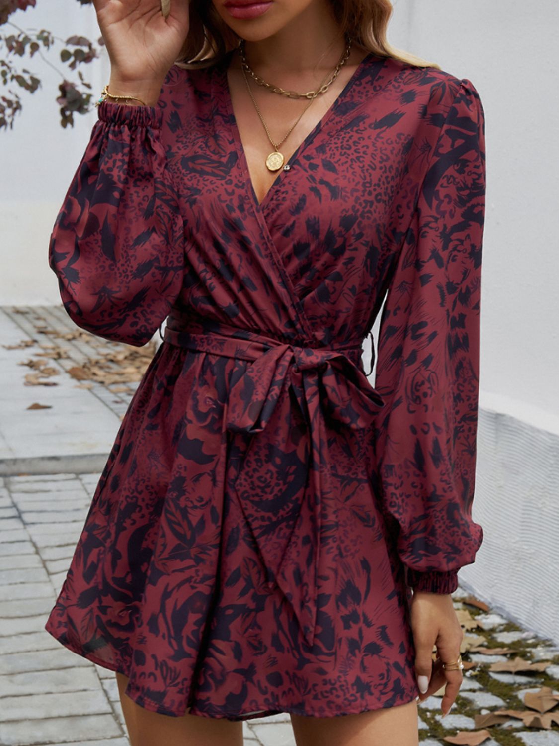 Devine Tied Surplice Long Sleeve Romper Trendsi