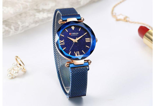 LAURYN Womens Classic Watch with blue mesh band and rock crystal bezel.