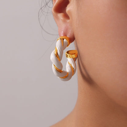 18K gold-plated twisted leather rope C-hoop earrings on ear.