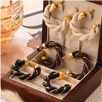 Twisted Leather Rope C-Hoop Earrings in gold-plated and braided leather.