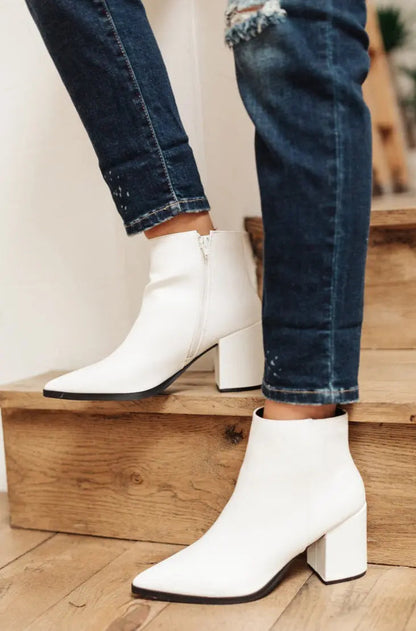 White Amari Ankle Boots with pointed toe and zipper.