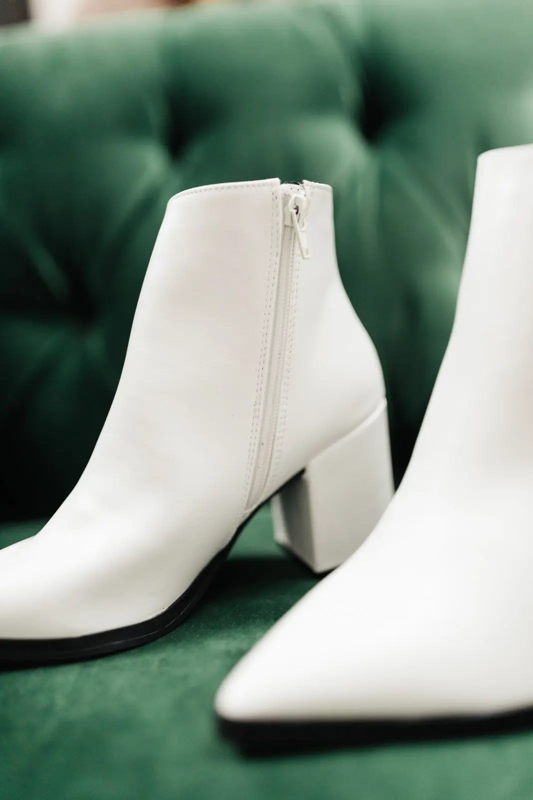 White Amari Ankle Boots with pointed toe and zipper, faux leather.