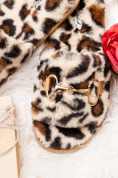 Animal print slippers with faux fur and horse bit detail.