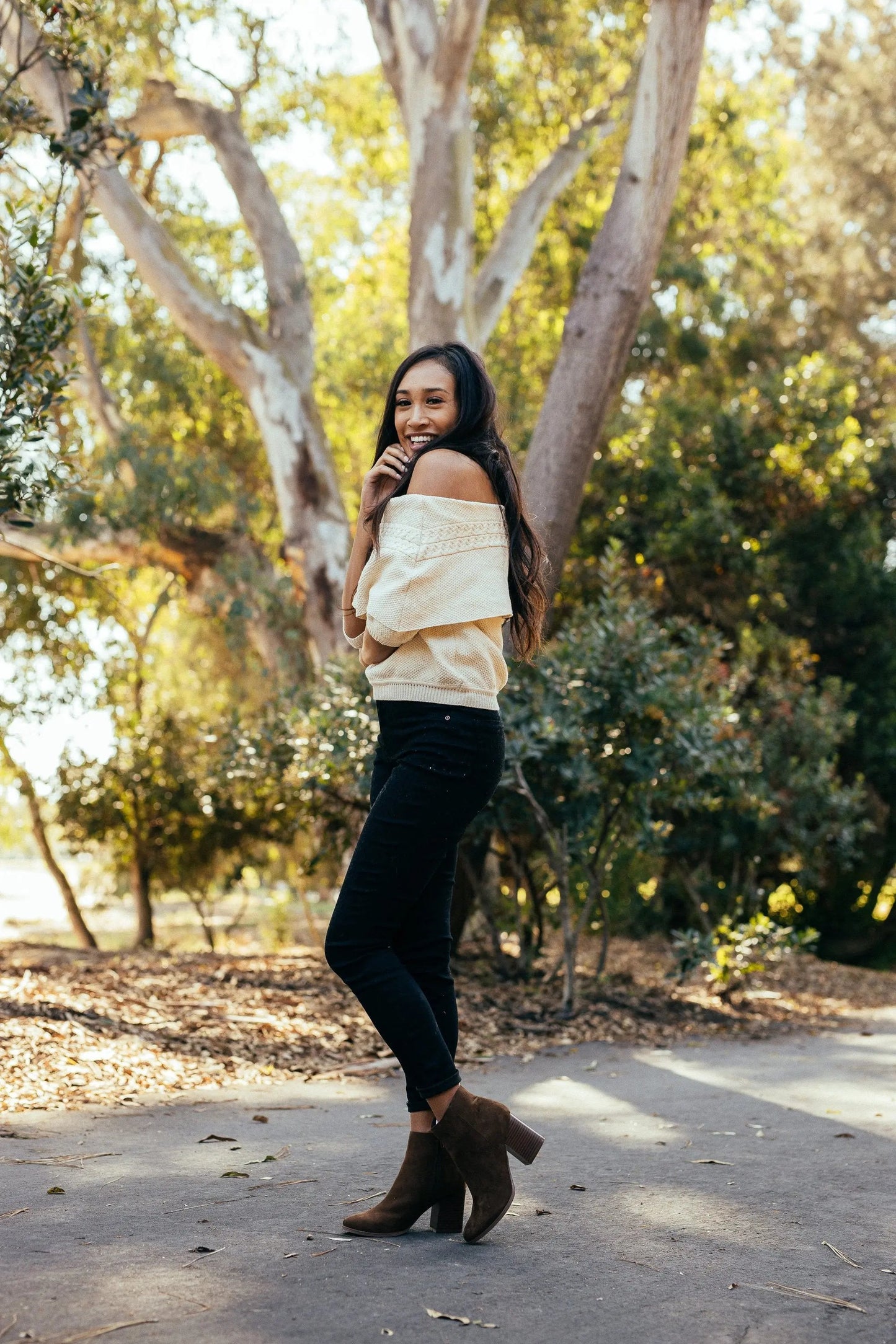 Woman wearing Women's Malibu Boots Brown with stacked heel and almond toe.