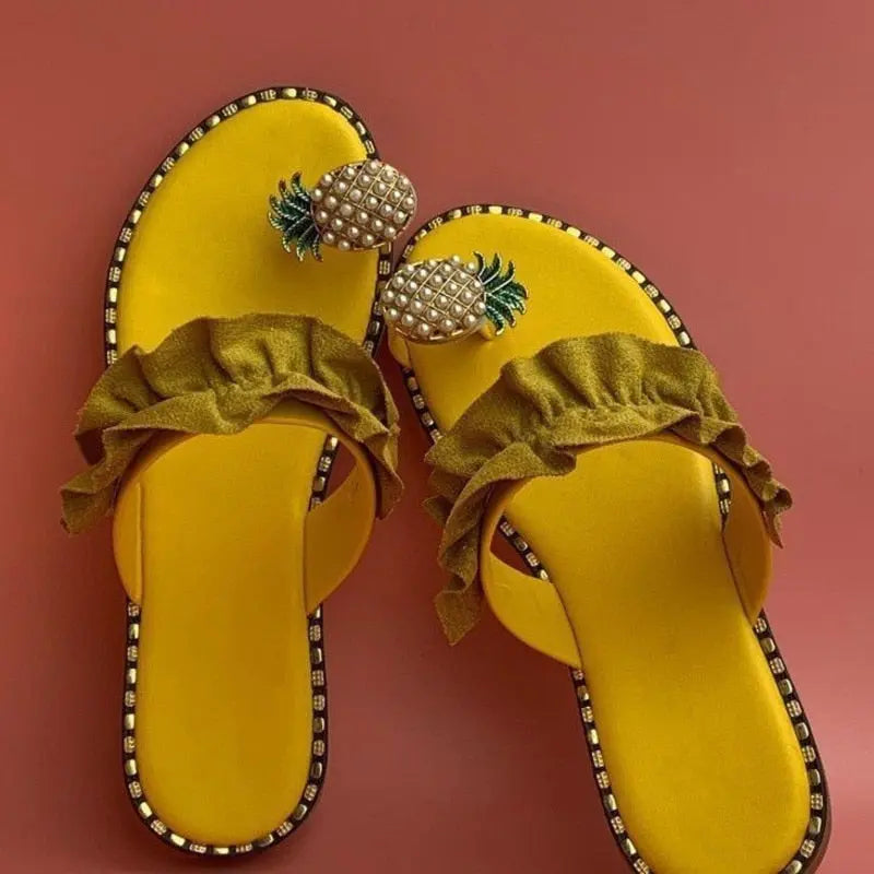 Pineapple pearl beach slides with flat toe design for casual women's wear.