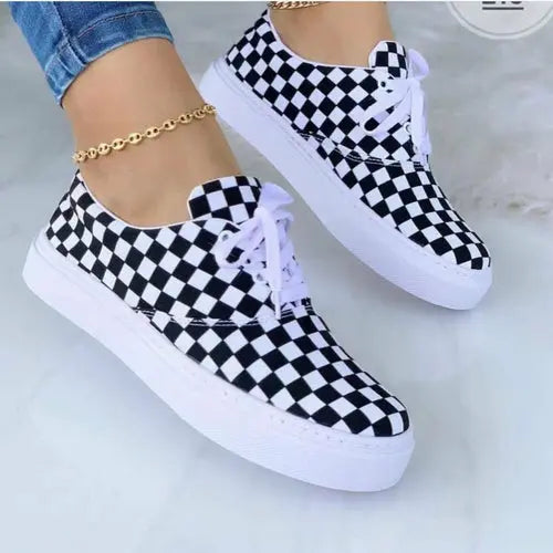 2024 fashion graffiti women's sneakers with a black and white checkered design.