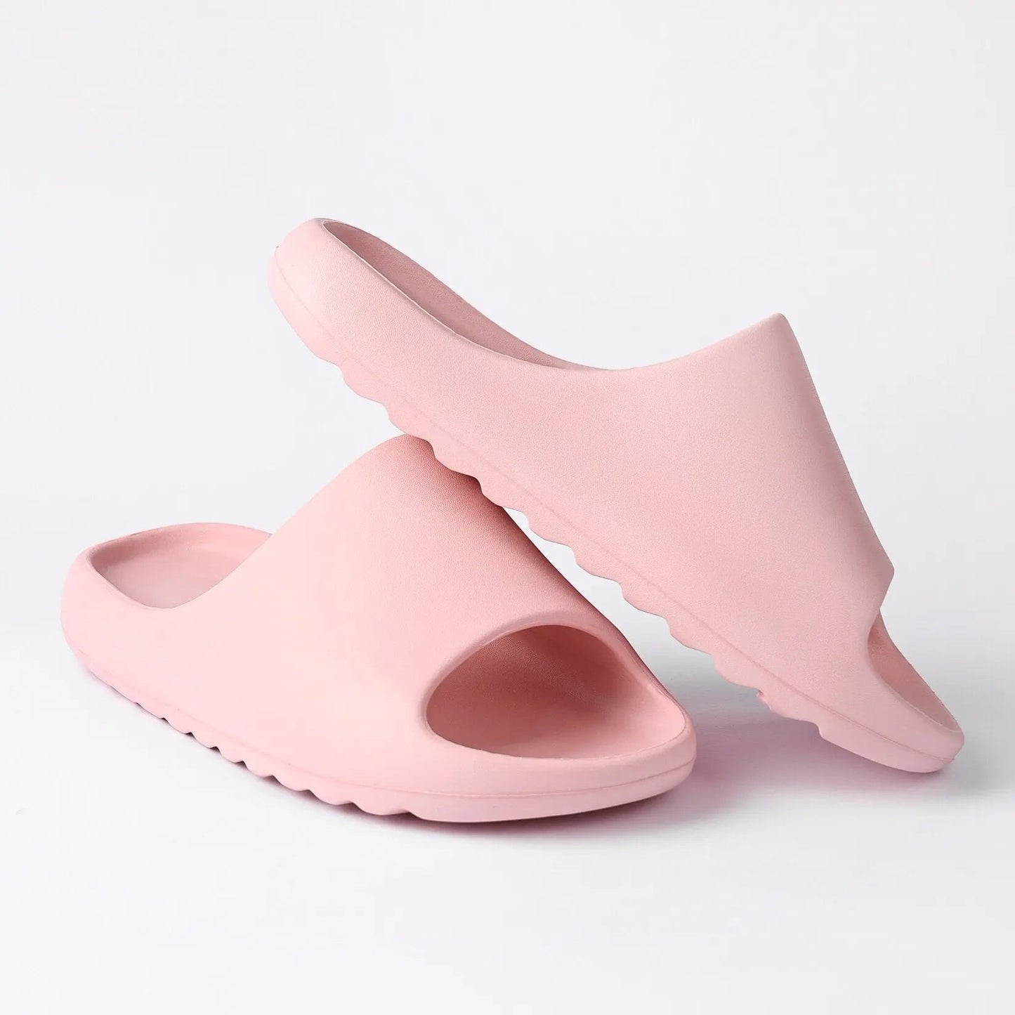 Pink cloud pillow slippers for women, ideal shower shoes for college dorms with a platform design and open toe.