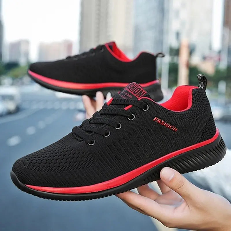 Men's black and red lightweight running sneakers with breathable mesh upper and cushioned insole.