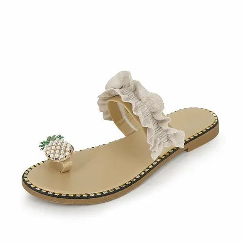 Pineapple pearl embellished beach slides with flat toe and ruffle strap for women.