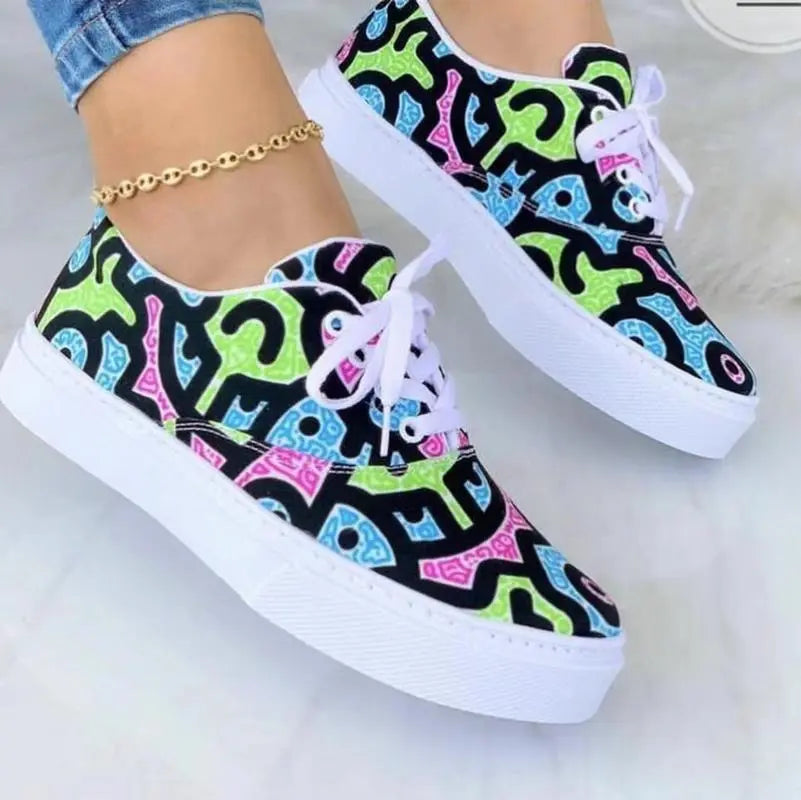 Colorful graffiti-style women's sneakers, 2024 fashion trainers.