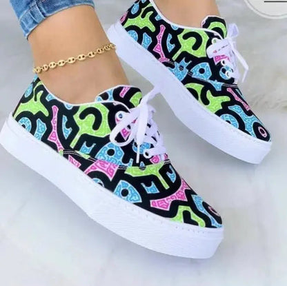 2024 Fashion Graffiti Women Sneakers Trainers Shoes with vibrant patterns and white soles.