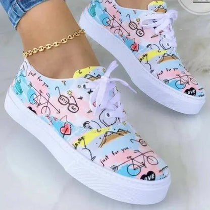 2024 fashion graffiti women's sneakers with colorful designs and white soles.