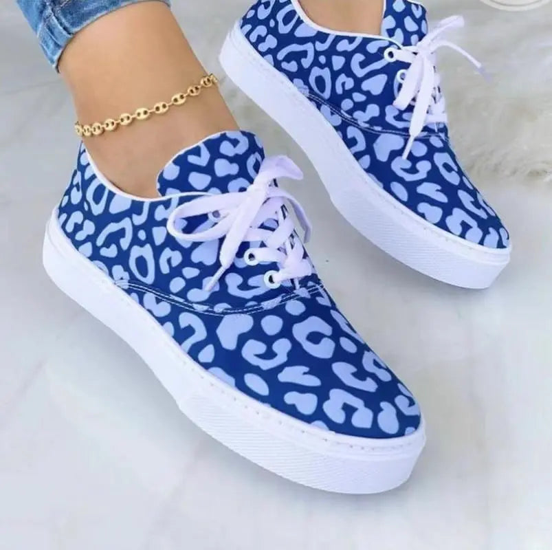 2024 fashion graffiti women sneakers trainers shoes in blue with white laces and leopard print design.