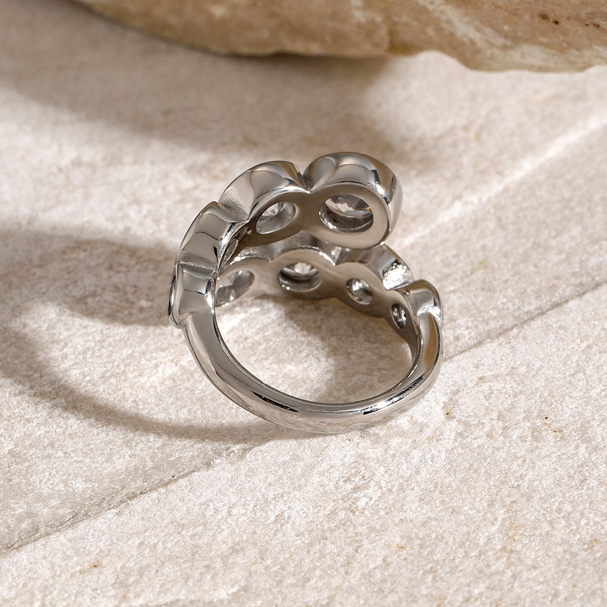 Stainless Steel Inlaid Zircon Bypass Ring on neutral background showcasing elegant design.