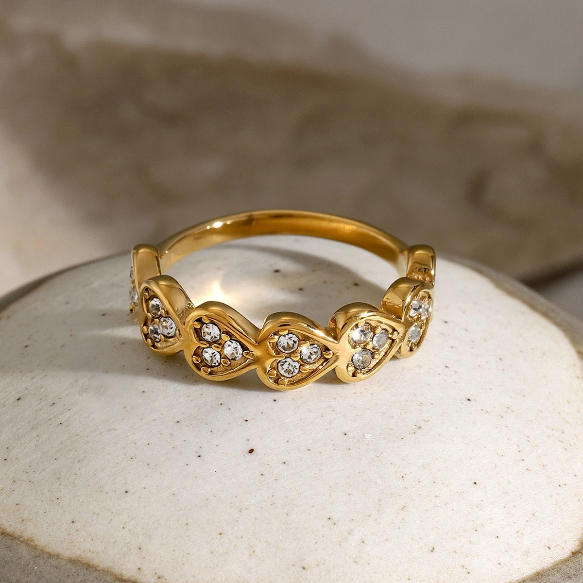 18K gold-plated stainless steel zircon heart ring on display.