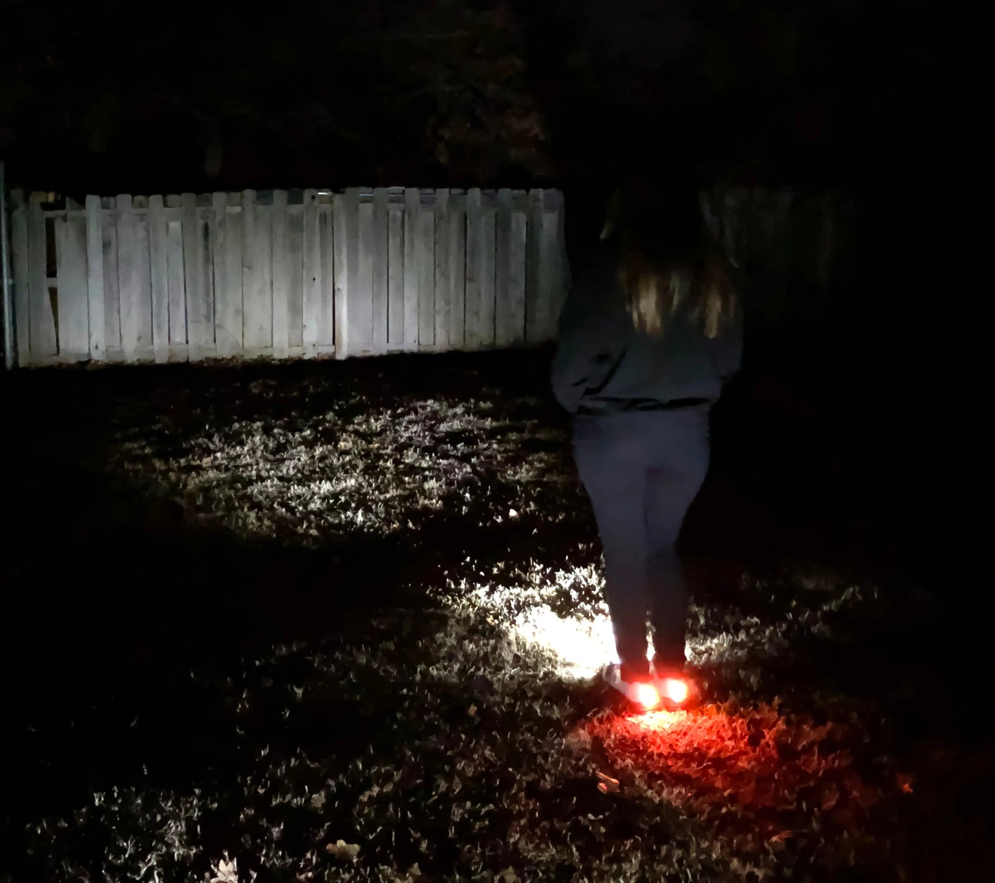 Women's Night Runner Shoes illuminating in the dark with built-in safety lights.