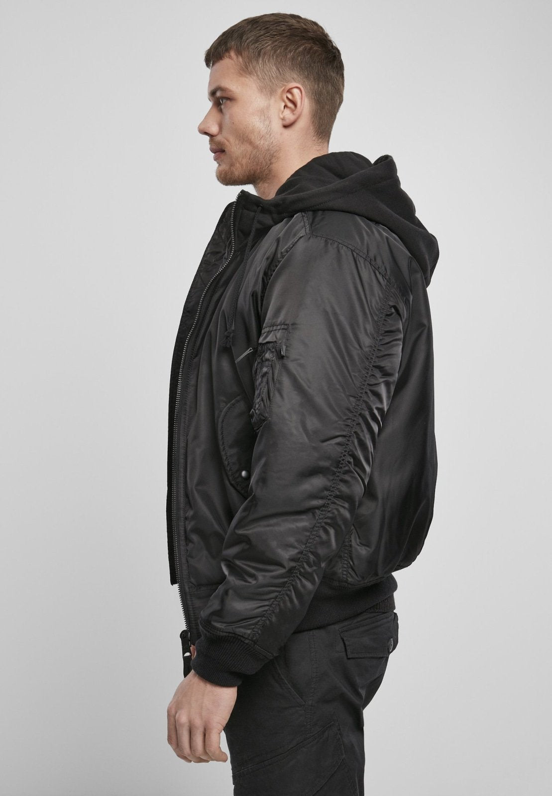 Hooded MA1 Bomber Jacket in black, side view showcasing nylon material and hooded design.