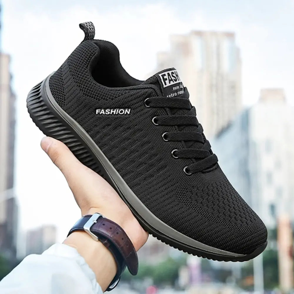 Black men's lightweight running sneaker with breathable mesh upper and durable rubber outsole, ideal for exercise.